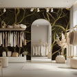 Tree branch wallpaper with gold details creating an elegant atmosphere in a modern living room