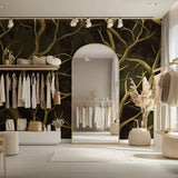 Tree branch wallpaper with gold details creating an elegant atmosphere in a modern living room