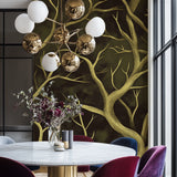 Botanical wall mural featuring golden branches in a home office space
