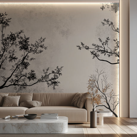 Black and white tree branch wallpaper creating depth in a modern living room setting