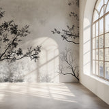 Minimalist tree silhouette mural adding character to a bright bedroom space