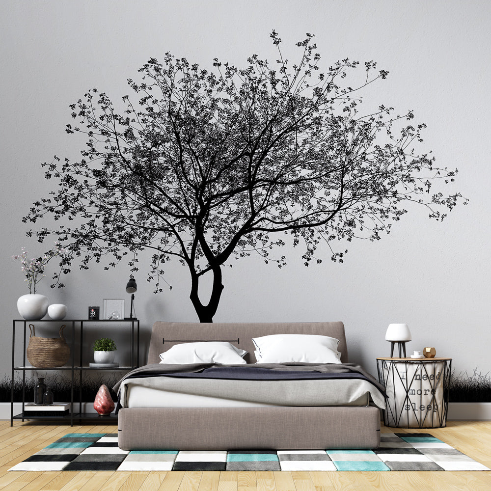 Black and white tree wallpaper creating a stunning focal point in a minimalist living room with modern furniture