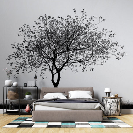Black and white tree wallpaper creating a stunning focal point in a minimalist living room with modern furniture