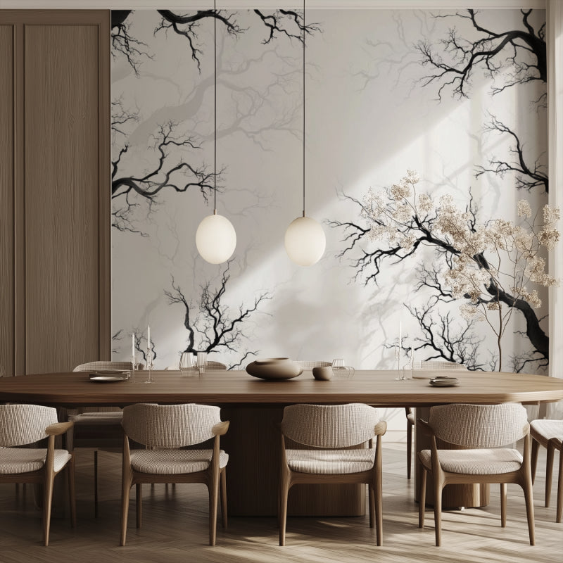 Black and white tree mural in dining room with wooden table and pendant lights