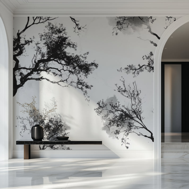 Minimalist bedroom with black tree wall mural adding natural elegance