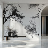 Minimalist bedroom with black tree wall mural adding natural elegance