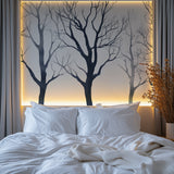 Black and white tree mural creating depth in a modern home office space