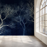 Tree branch wallpaper creating dramatic impact in modern living room with white furniture