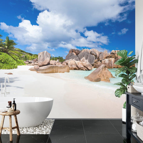 Tropical beach mural wallpaper creating a stunning focal point in a modern living room with white furniture