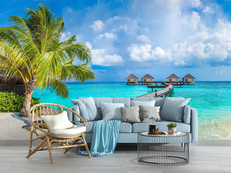 Tropical beach wallpaper creating a stunning focal point in a modern living room with white furniture