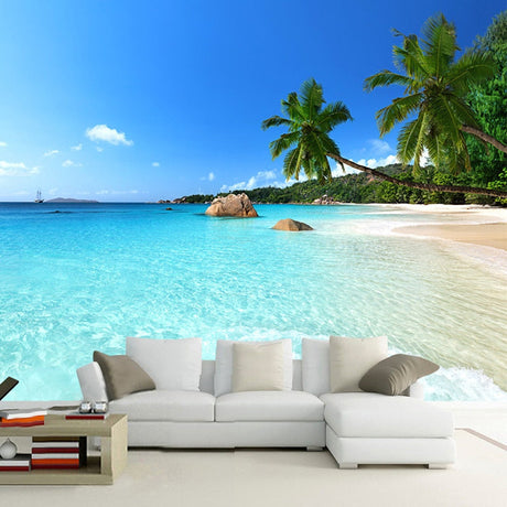 Tropical beach wallpaper bringing paradise vibes to a modern living room with white furniture