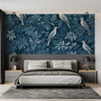 Tropical birds wallpaper in blue tones creating a peaceful atmosphere in a modern living room
