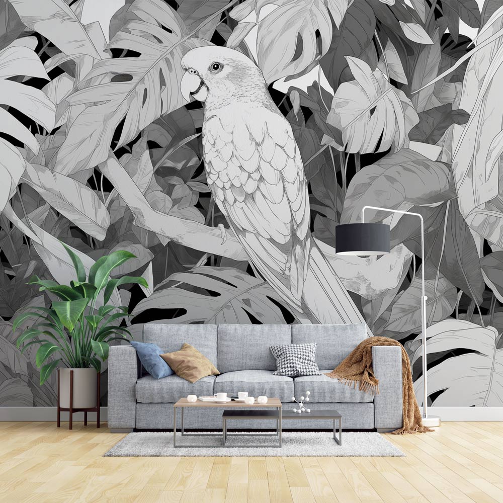 Modern living room featuring a striking Tropical Birds wallpaper with black and white parrot and monstera leaves