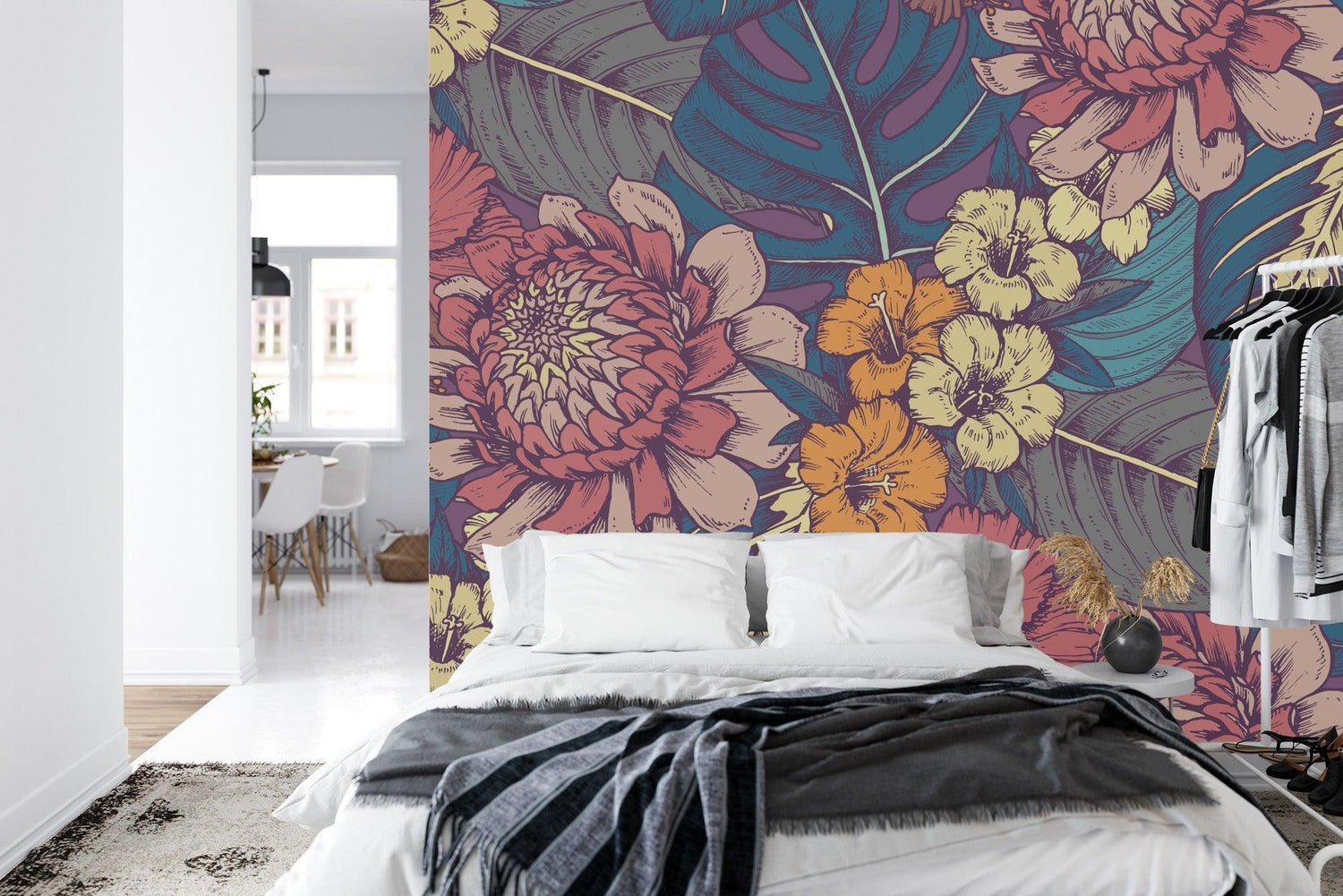 Tropical floral wallpaper with hibiscus and monstera leaves creating a cozy atmosphere in a modern living room