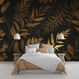 Black and gold botanical wallpaper creating a luxurious atmosphere in a modern dining room with ambient lighting
