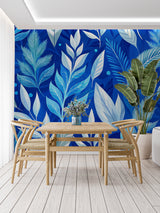 Home office with blue tropical foliage wallpaper creating a calm workspace