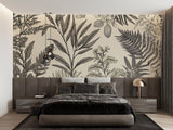 Black and white tropical leaf mural in a bedroom, showcasing delicate botanical line art