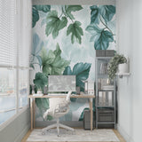 Green botanical wallpaper making a statement in a bright home office