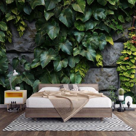 Tropical leaf wallpaper in modern living room showing lush green foliage against textured stone wall