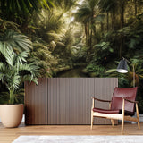 Sunlit jungle paradise mural creating depth in a cozy bedroom setting