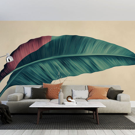 Tropical leaf wallpaper in modern living room showing large-scale burgundy and green botanical design against beige wall