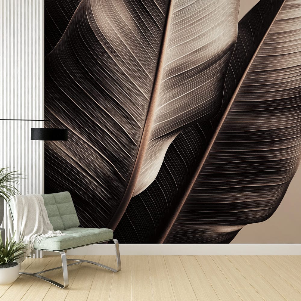 Tropical leaf wallpaper in minimalist black and beige creating a calm atmosphere in a modern living room setting
