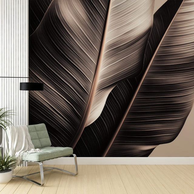 Tropical leaf wallpaper in minimalist black and beige creating a calm atmosphere in a modern living room setting