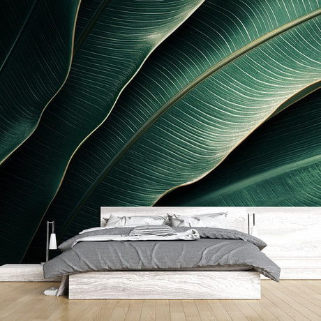 Tropical leaf wallpaper creating a luxurious atmosphere in a modern living room with natural light
