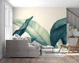 Entryway decorated with teal palm leaf wallpaper creating an inviting tropical feel