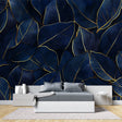 Navy and gold tropical leaf wallpaper in modern dining room showing luxury metallic details