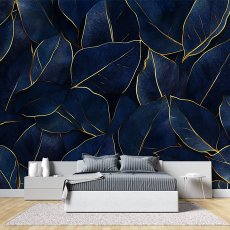 Navy and gold tropical leaf wallpaper in modern dining room showing luxury metallic details