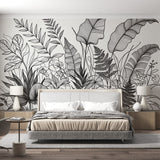 Black and white botanical line art wallpaper creating a stunning backdrop in a modern living room with minimal furniture