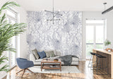 Minimalist home office featuring blue palm line art wallpaper with desk setup