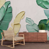 Tropical banana leaf wallpaper creating a fresh modern atmosphere in a bright living room with natural light