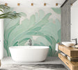 Tropical leaf wallpaper in mint green creating a fresh look in modern living room