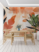 Modern dining room featuring tropical leaf wallpaper in warm terracotta tones