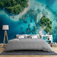 Tropical beach paradise wallpaper in modern living room showing turquoise waters and white sand from above