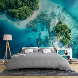 Tropical beach paradise wallpaper in modern living room showing turquoise waters and white sand from above