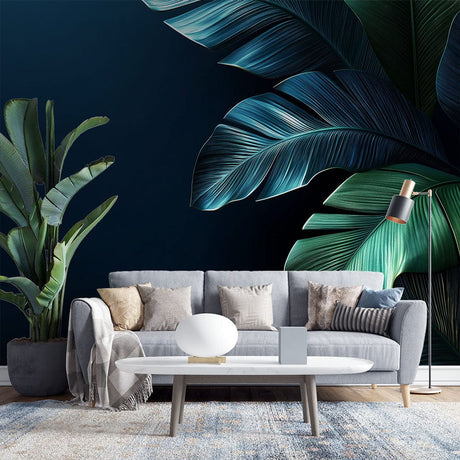 Tropical banana leaf wallpaper in modern dining room with dark navy backdrop and emerald green leaves creating dramatic atmosphere