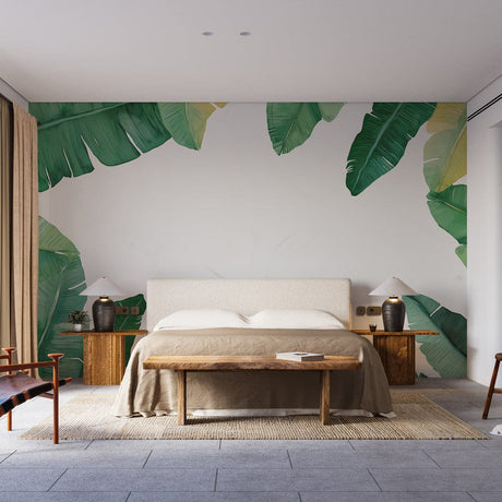Tropical banana leaf wallpaper creating a fresh accent wall in a bright living room with modern furniture