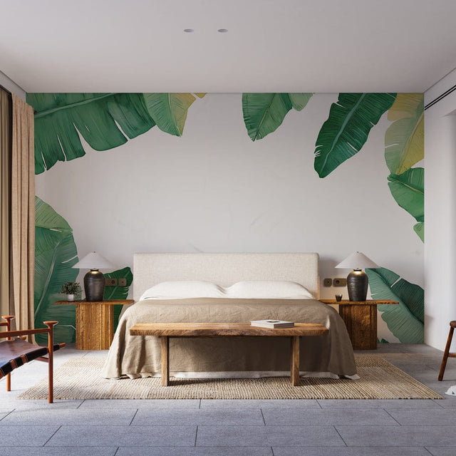 Tropical banana leaf wallpaper creating a fresh accent wall in a bright living room with modern furniture
