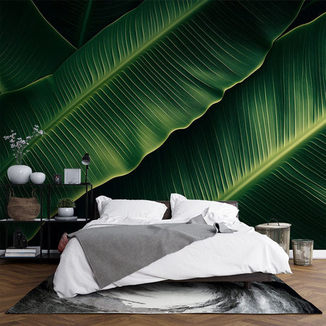 Tropical banana leaf wallpaper creating a lush atmosphere in a modern living room with natural light