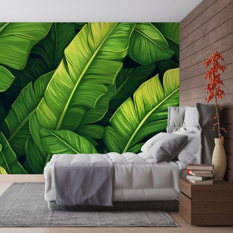 Tropical leaf wallpaper creating a luxury hotel feel in a modern living room with natural light and minimal furniture