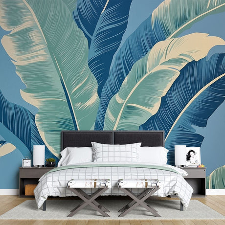 Tropical leaf wallpaper in modern living room showing blue and mint banana leaves creating a fresh, coastal atmosphere