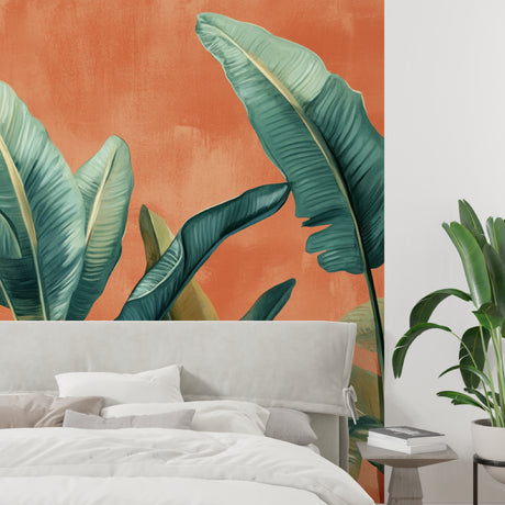 Tropical leaf wallpaper in modern living room with natural light showing banana leaves on terracotta