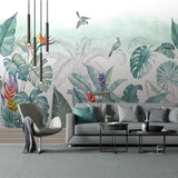Home office space transformed with tropical paradise wallpaper showing birds in flight
