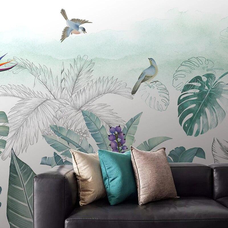 Dining room showcase with monstera and birds wallpaper creating depth and movement