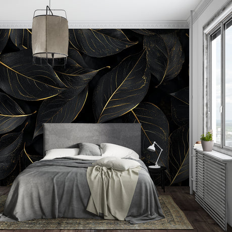 Black and gold leaf wallpaper in modern dining room with pendant lights highlighting metallic details