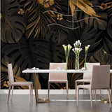 Luxury black and gold leaf wallpaper bringing elegance to a dining room space