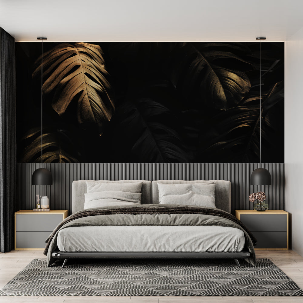Black and gold tropical wallpaper creating drama in modern living room with grey sofa